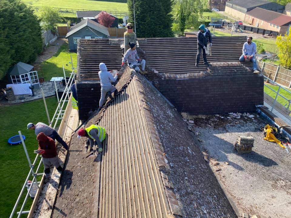 Professional roofers working on a property in London - KS Roof Master