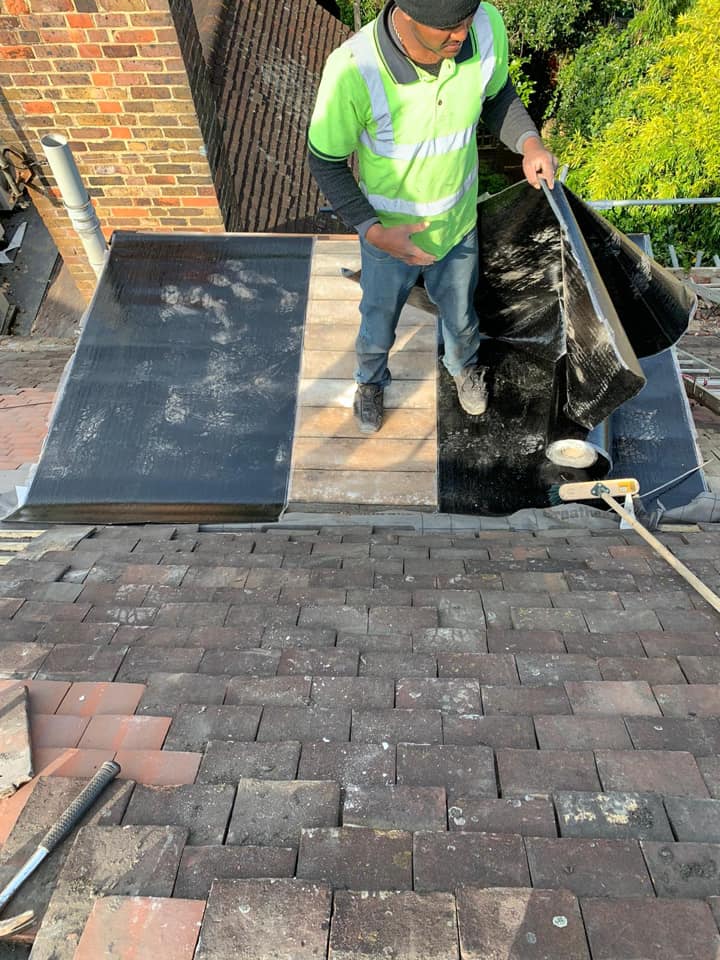 Professional roofers working on a property in London - KS Roof Master