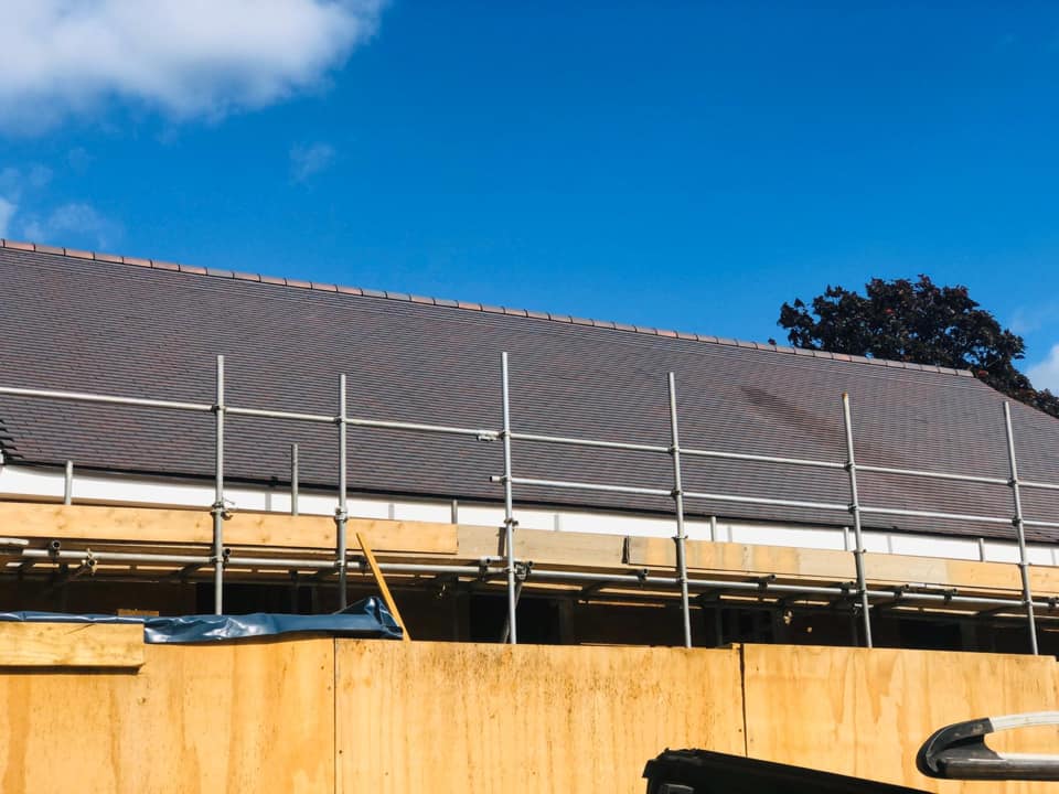Professional roofers working on a property in London - KS Roof Master