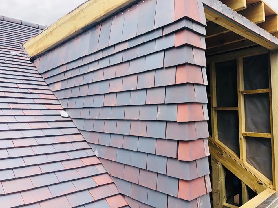 Professional roofers working on a property in London - KS Roof Master