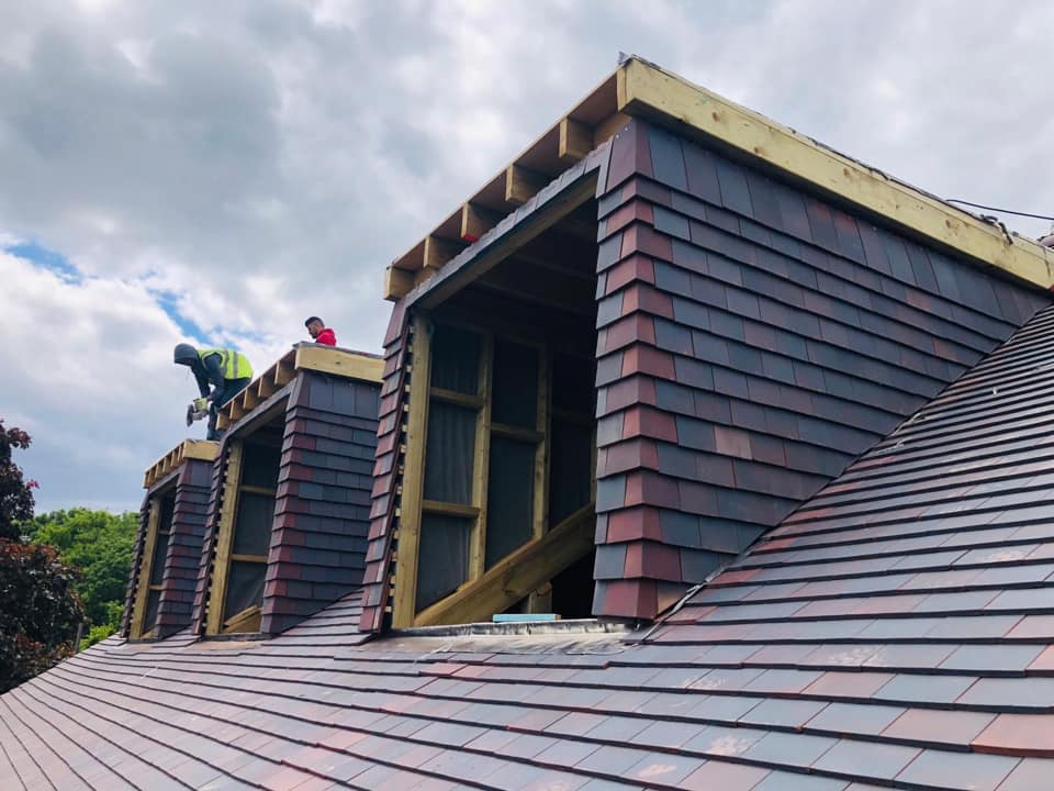 Professional roofers working on a property in London - KS Roof Master