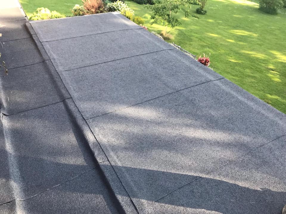 Professional roofers working on a property in London - KS Roof Master