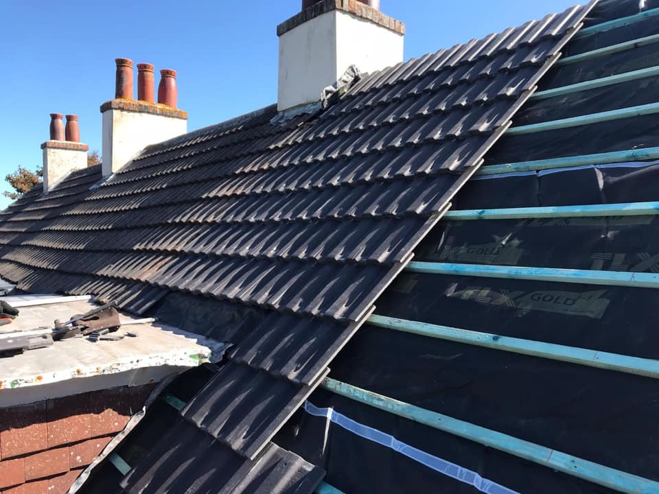 Professional roofers working on a property in London - KS Roof Master