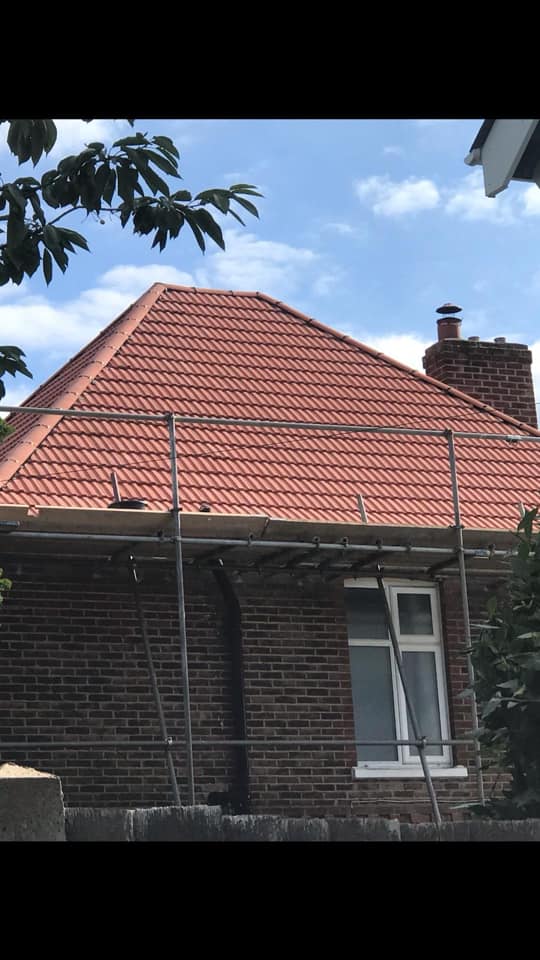 Professional roofers working on a property in London - KS Roof Master