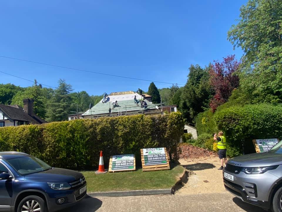 Professional roofers working on a property in London - KS Roof Master