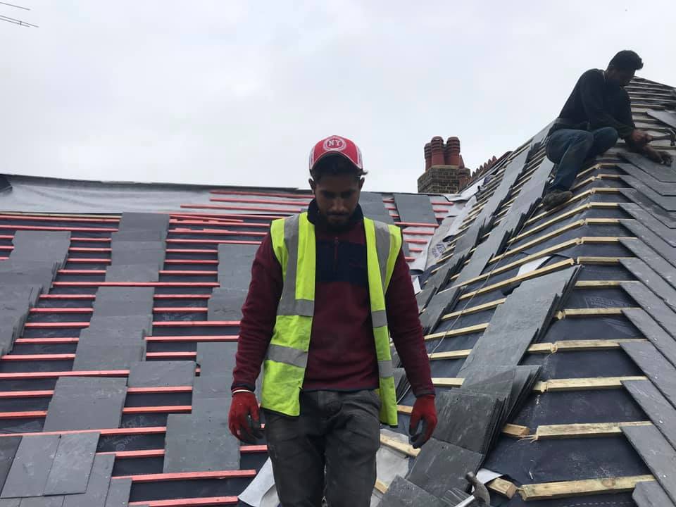 Professional roofers working on a property in London - KS Roof Master