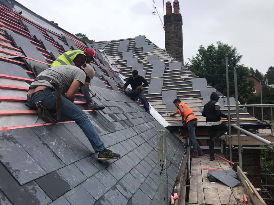 Professional roofers working on a property in London - KS Roof Master