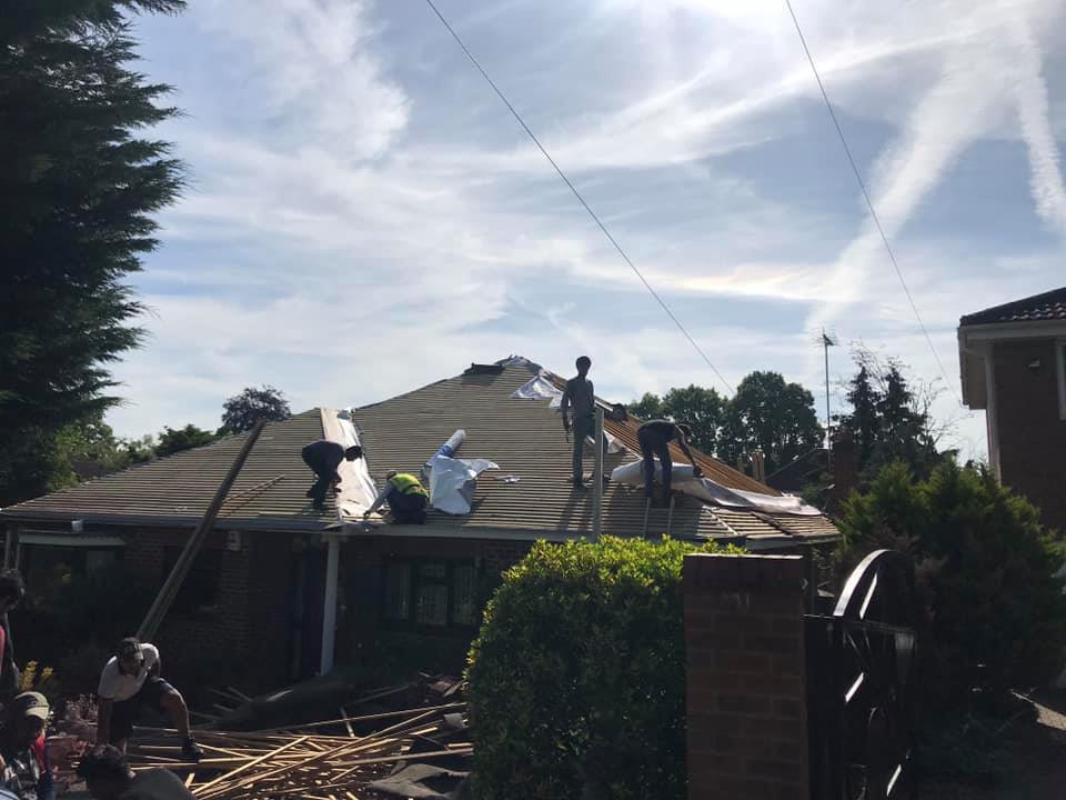 Professional roofers working on a property in London - KS Roof Master