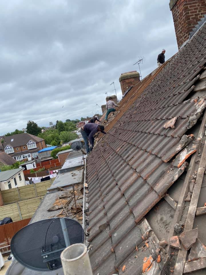 Professional roofers working on a property in London - KS Roof Master