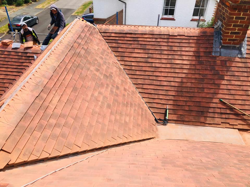 Professional roofers working on a property in London - KS Roof Master