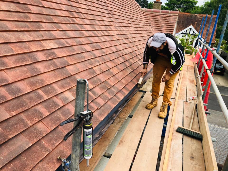 Professional roofers working on a property in London - KS Roof Master