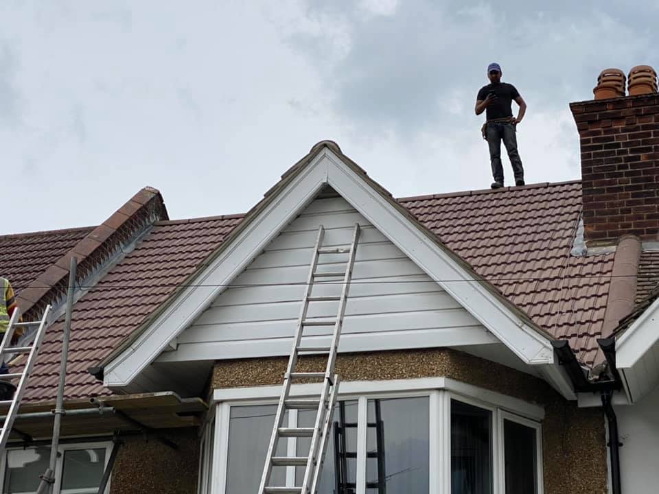 Professional roofers working on a property in London - KS Roof Master