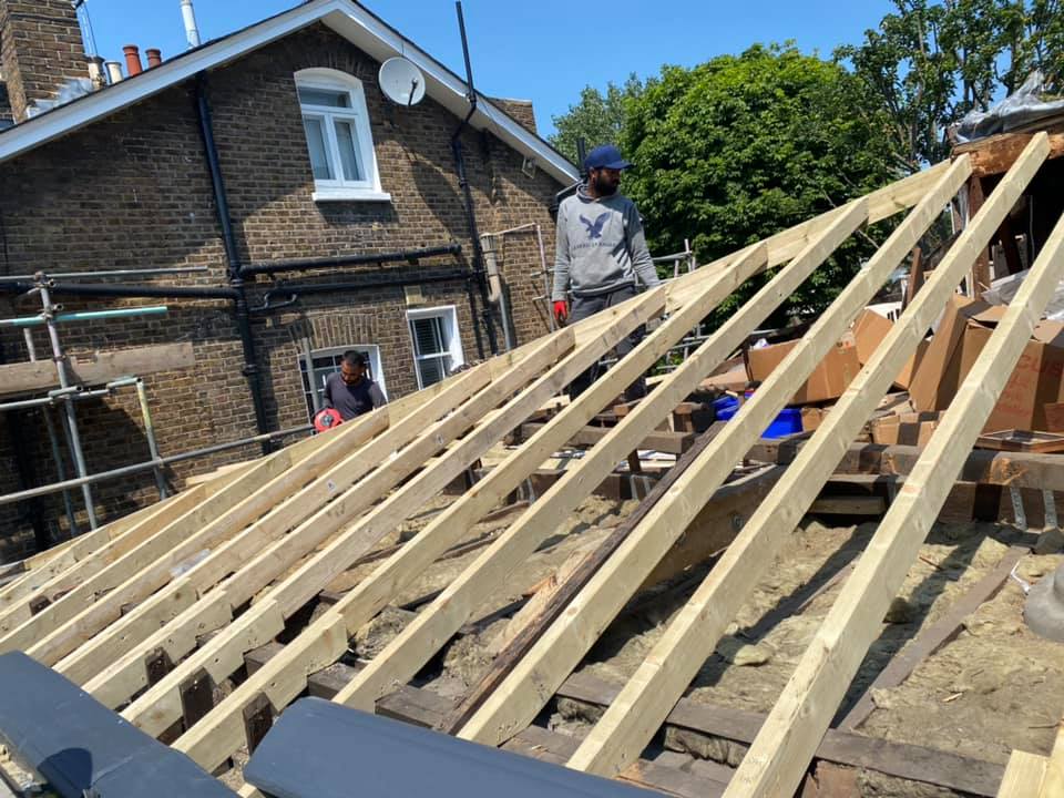 Professional roofers working on a property in London - KS Roof Master