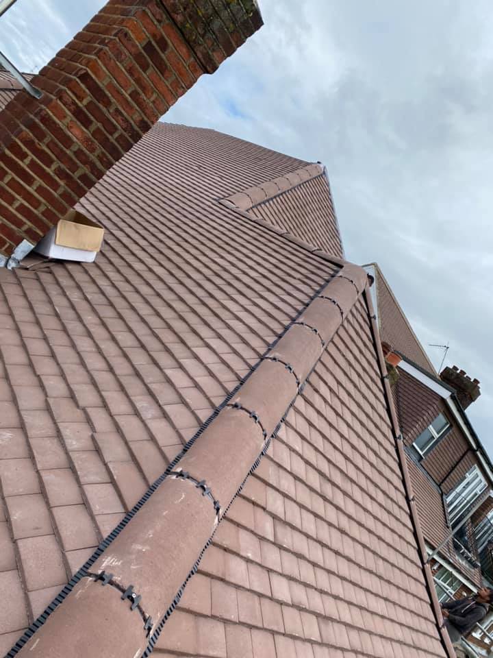 Professional roofers working on a property in London - KS Roof Master