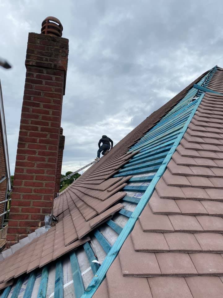 Professional roofers working on a property in London - KS Roof Master