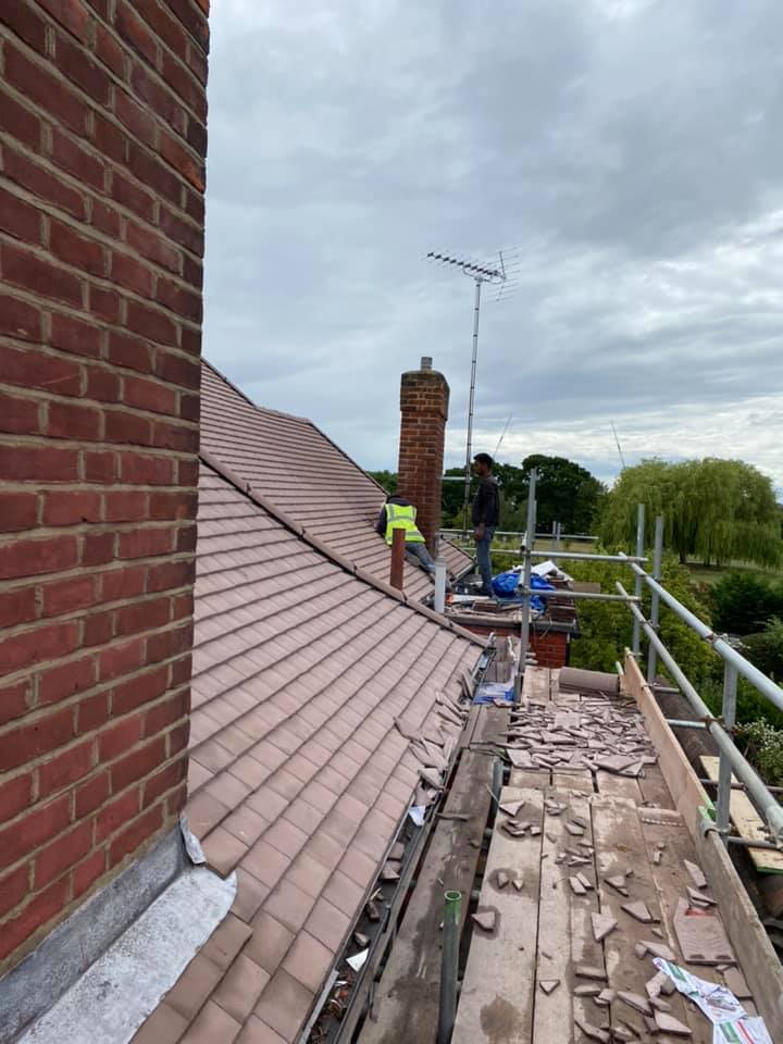 Professional roofers working on a property in London - KS Roof Master