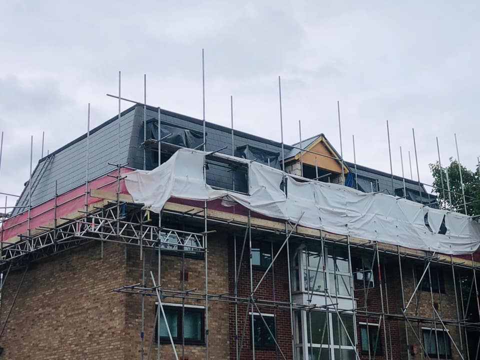 Professional roofers working on a property in London - KS Roof Master