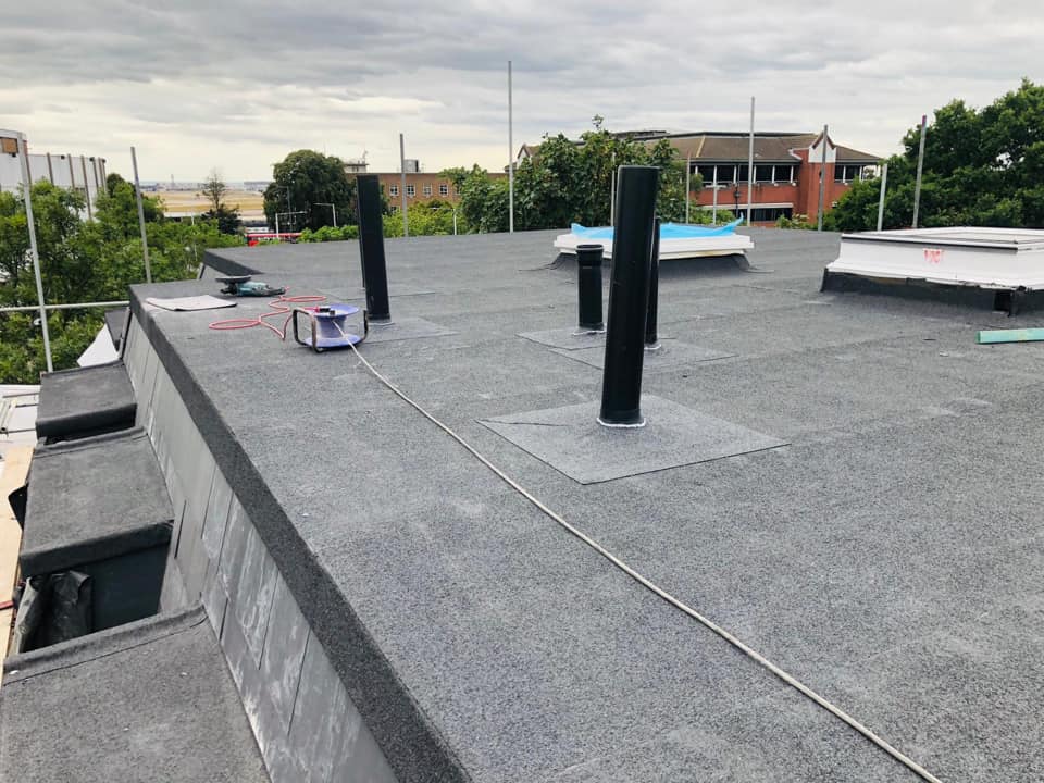 Professional roofers working on a property in London - KS Roof Master