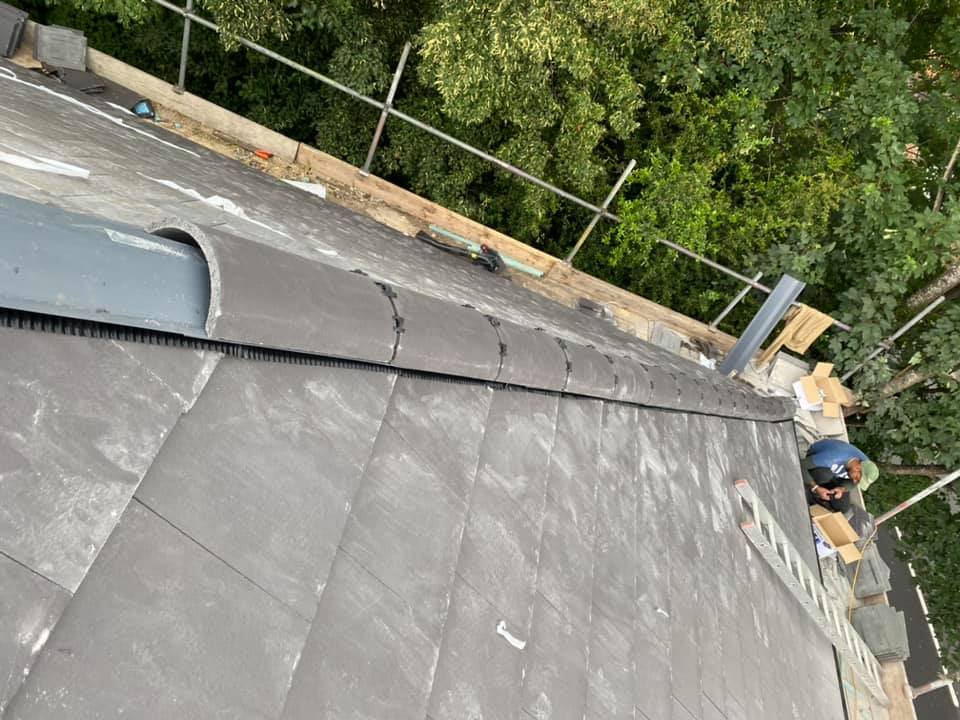 Professional roofers working on a property in London - KS Roof Master