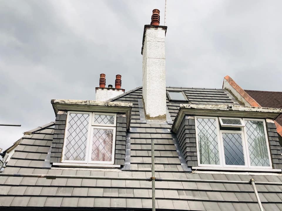 Professional roofers working on a property in London - KS Roof Master