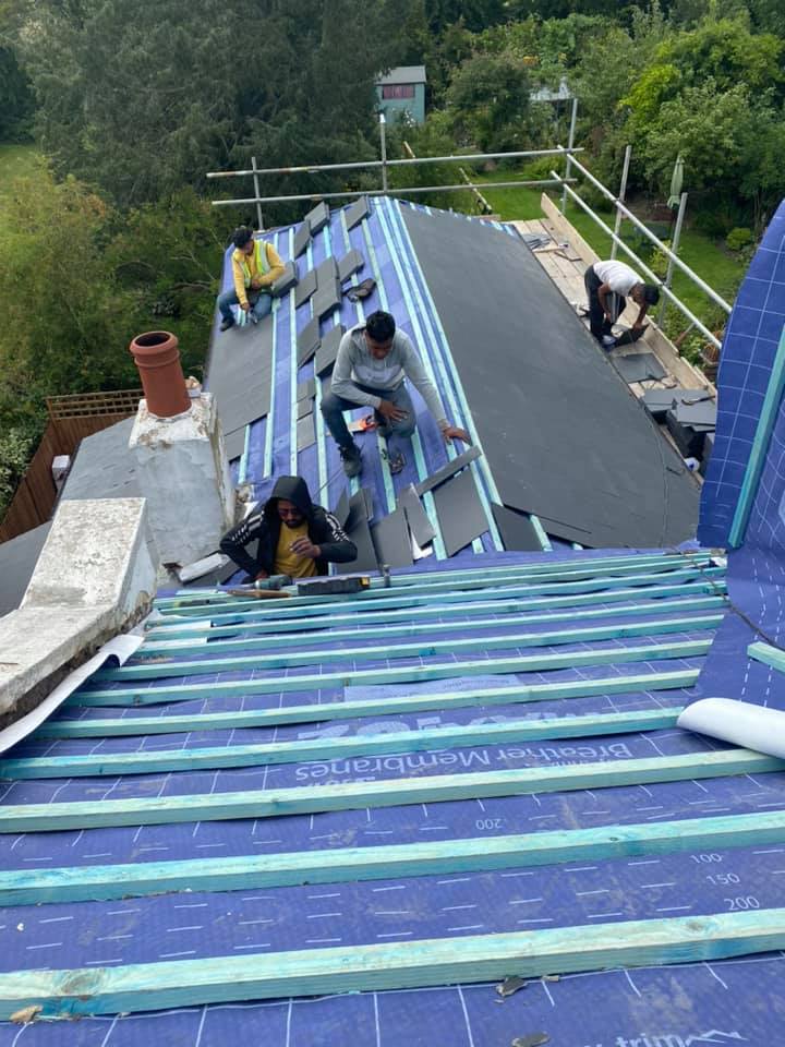 Professional roofers working on a property in London - KS Roof Master