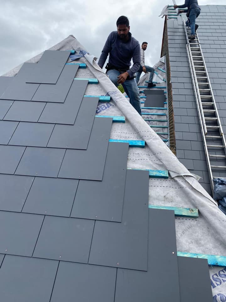 Professional roofers working on a property in London - KS Roof Master