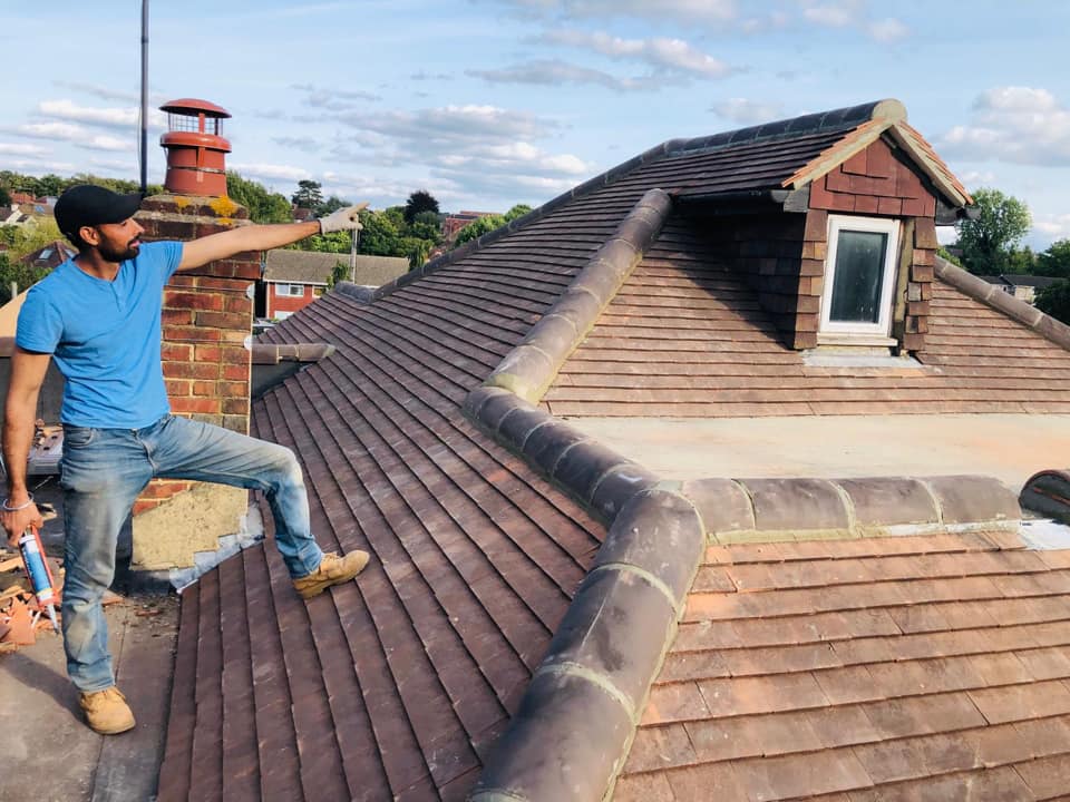 Professional roofers working on a property in London - KS Roof Master