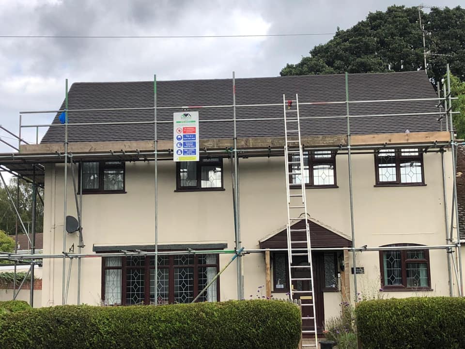 Professional roofers working on a property in London - KS Roof Master
