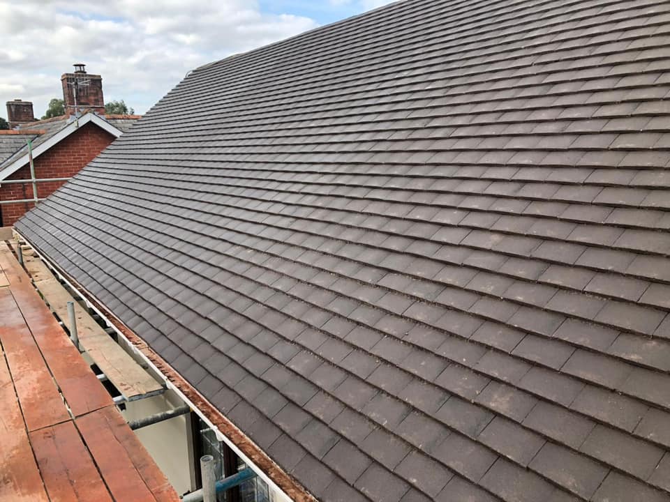 Professional roofers working on a property in London - KS Roof Master