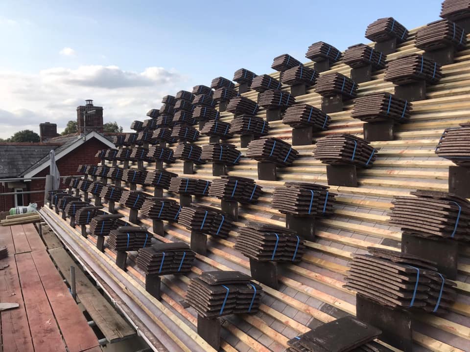 Professional roofers working on a property in London - KS Roof Master