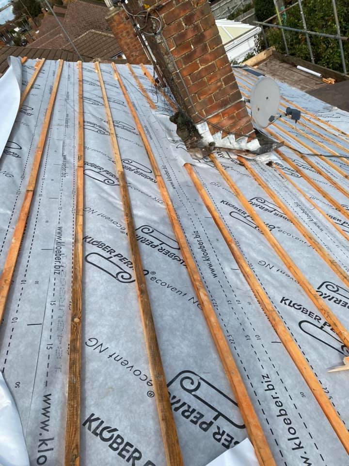 Professional roofers working on a property in London - KS Roof Master
