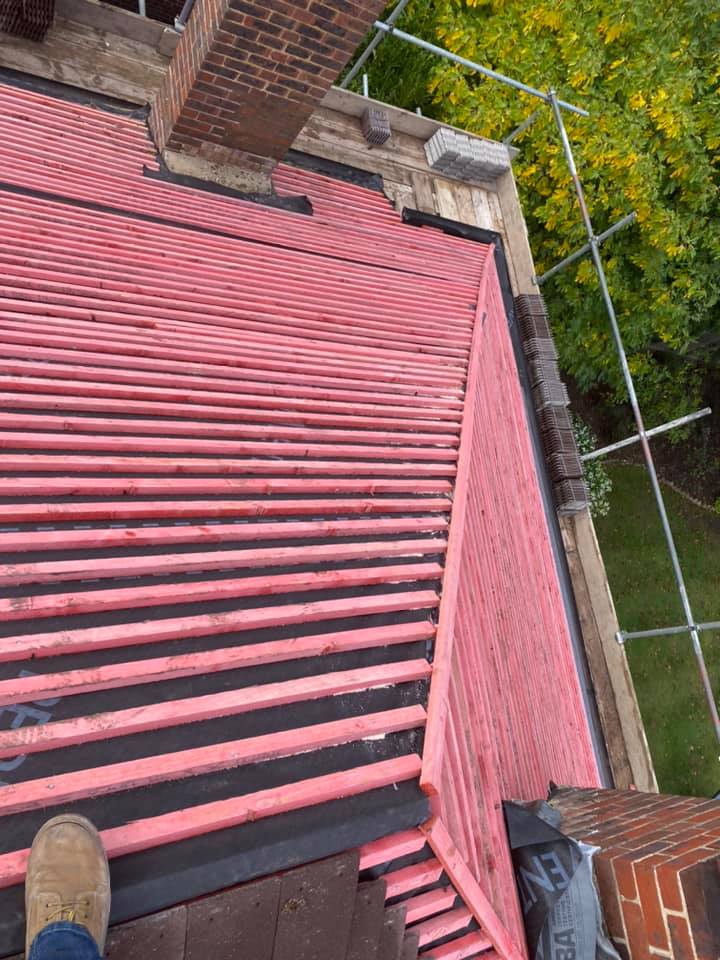 Professional roofers working on a property in London - KS Roof Master