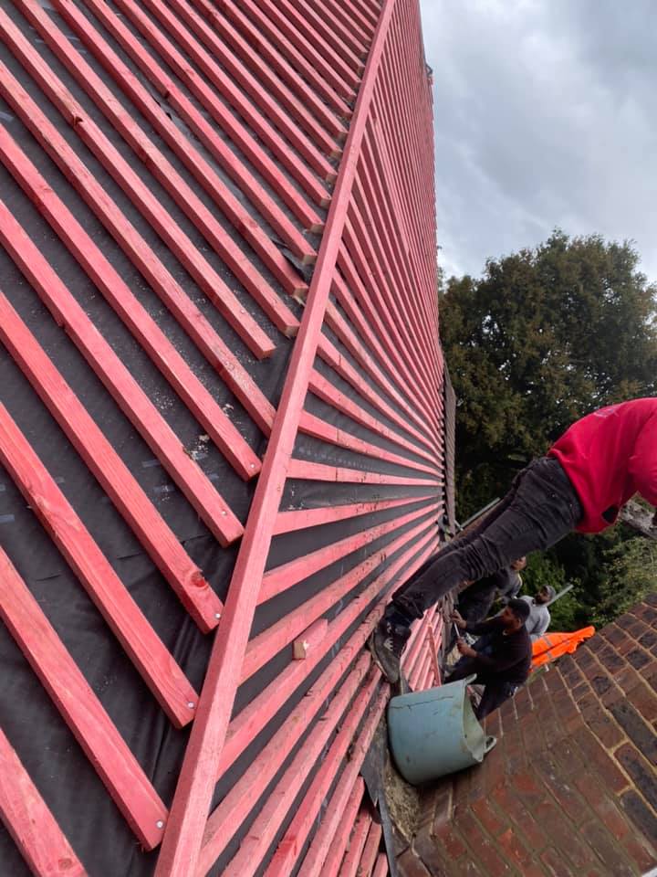 Professional roofers working on a property in London - KS Roof Master
