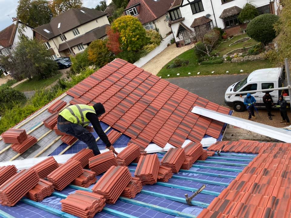 Professional roofers working on a property in London - KS Roof Master