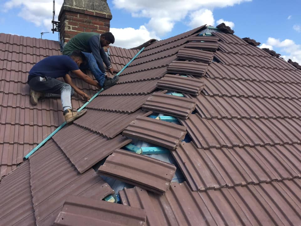 Professional roofers working on a property in London - KS Roof Master