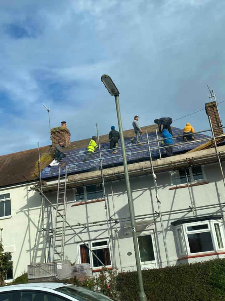 Professional roofers working on a property in London - KS Roof Master