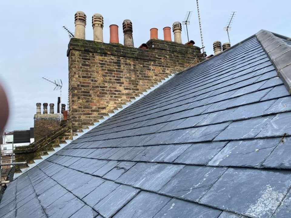 Professional roofers working on a property in London - KS Roof Master