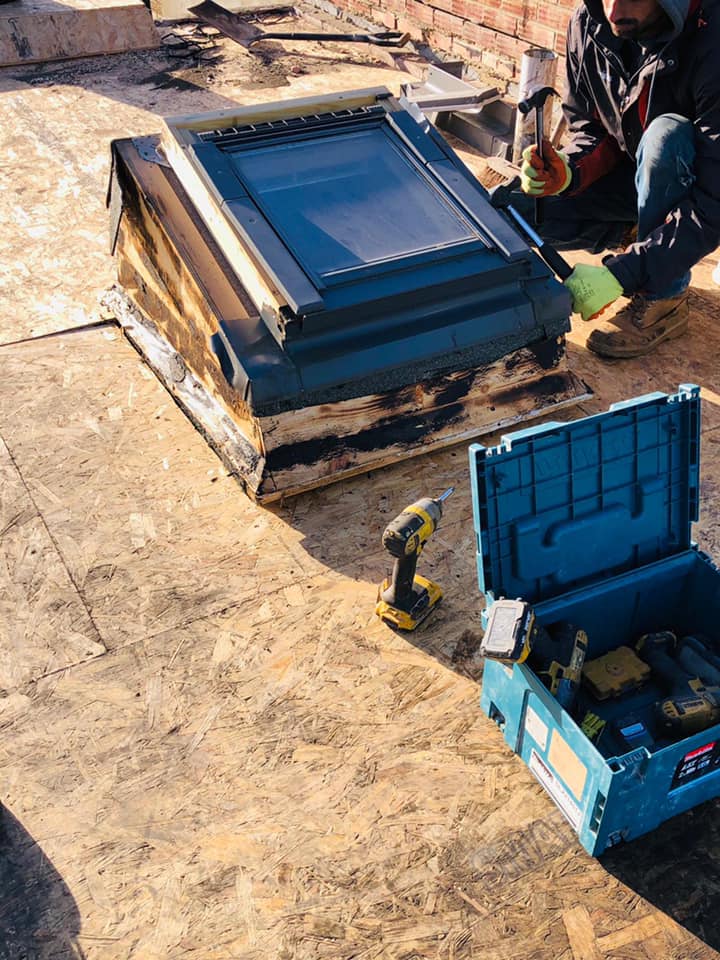 Professional roofers working on a property in London - KS Roof Master