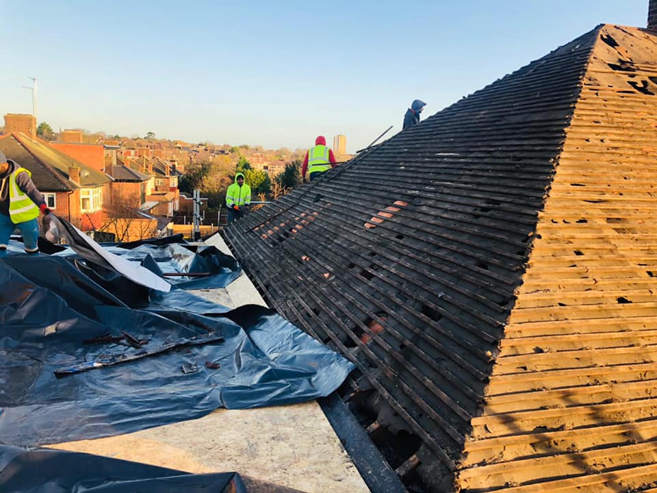 Professional roofers working on a property in London - KS Roof Master