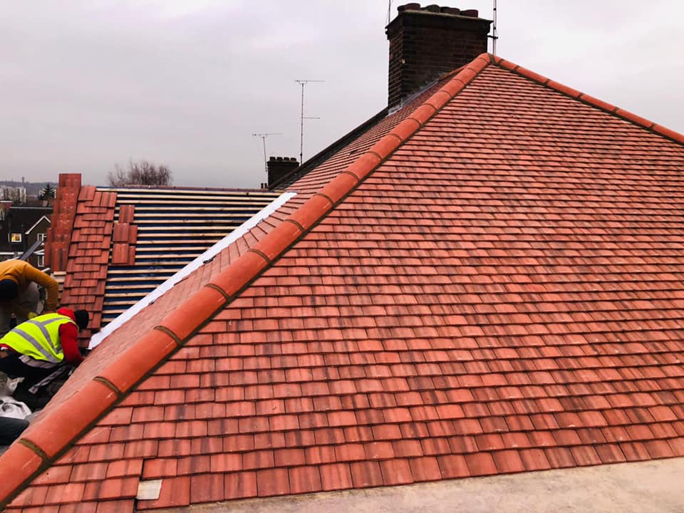 Professional roofers working on a property in London - KS Roof Master