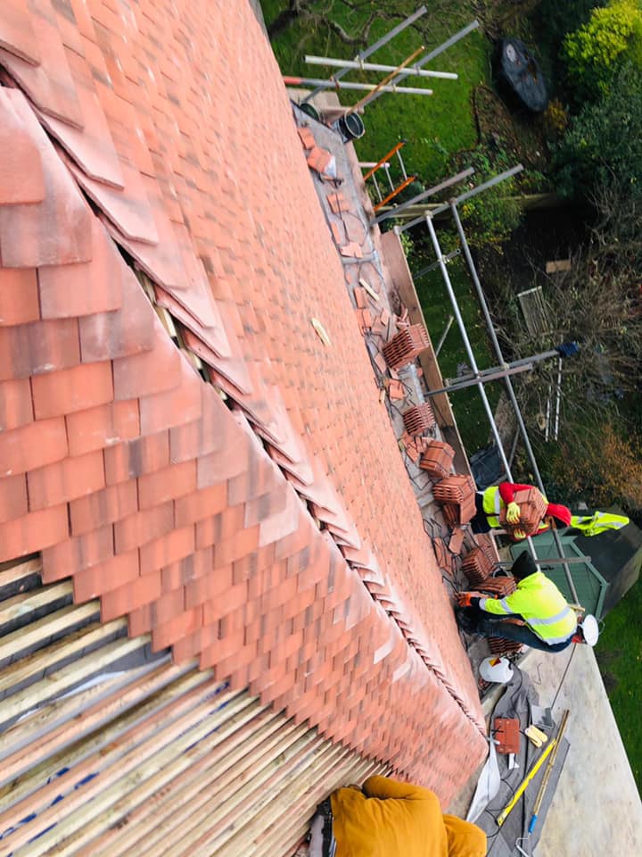 Professional roofers working on a property in London - KS Roof Master