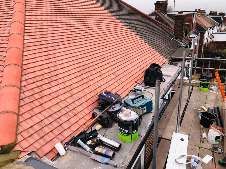 Professional roofers working on a property in London - KS Roof Master