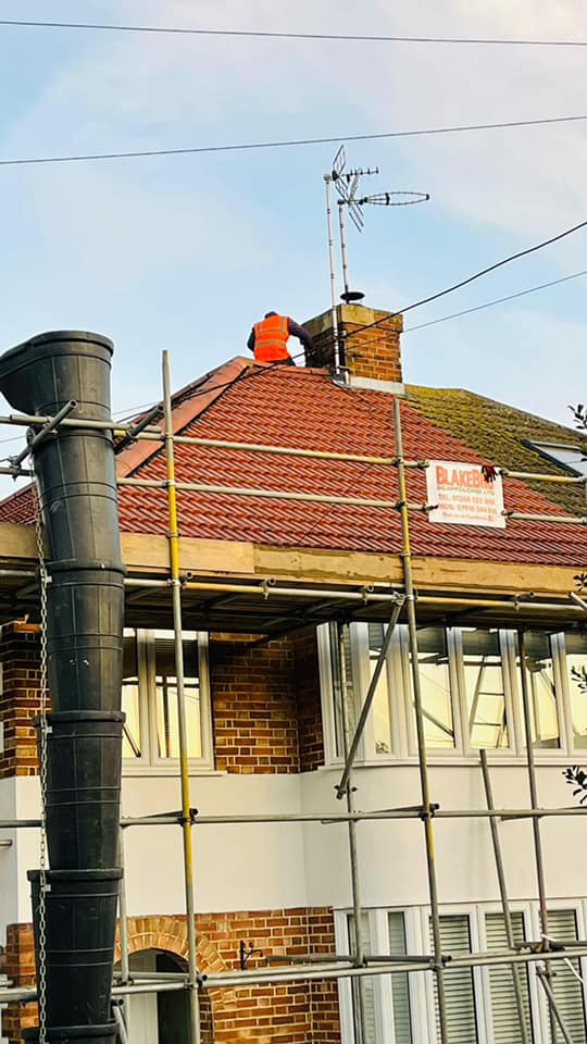 Professional roofers working on a property in London - KS Roof Master