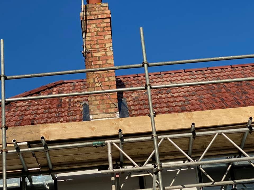 Professional roofers working on a property in London - KS Roof Master