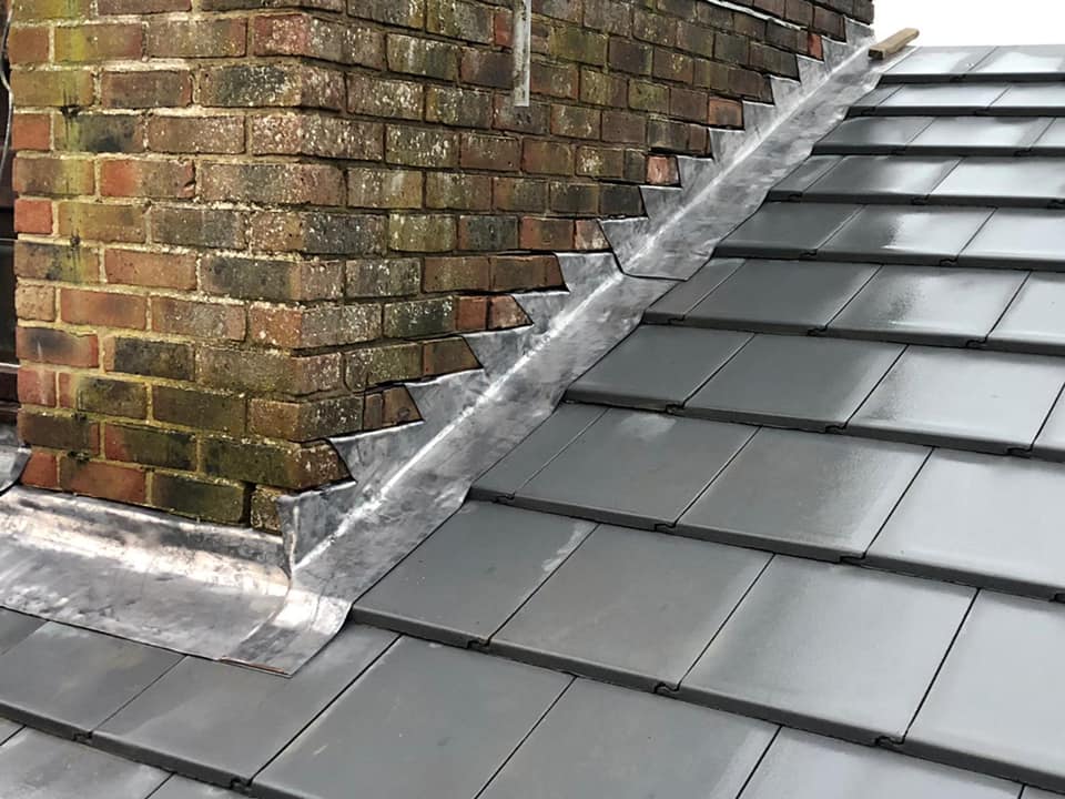 Professional roofers working on a property in London - KS Roof Master