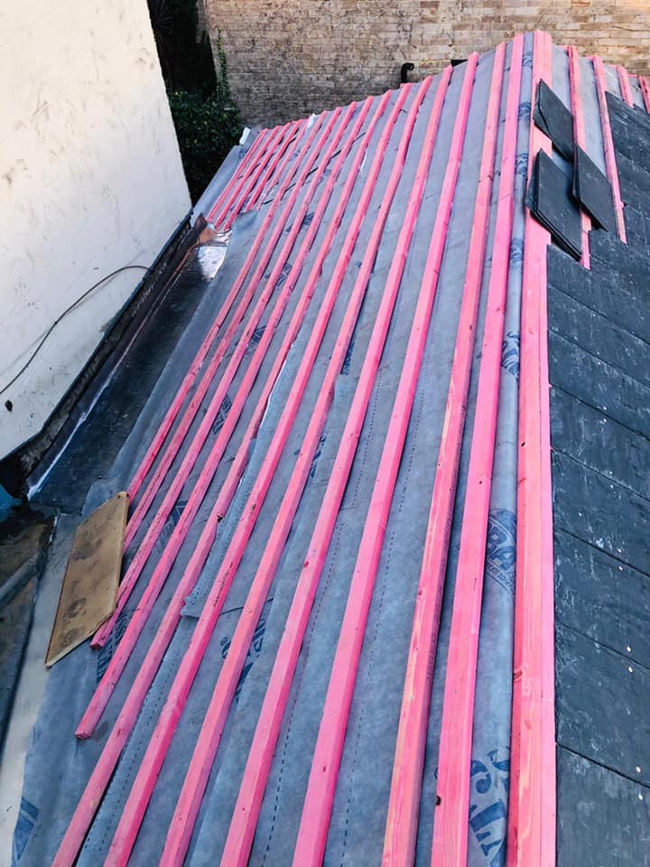 Professional roofers working on a property in London - KS Roof Master