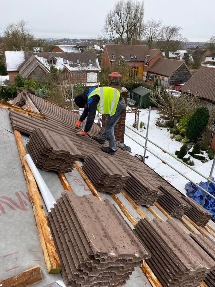 Professional roofers working on a property in London - KS Roof Master