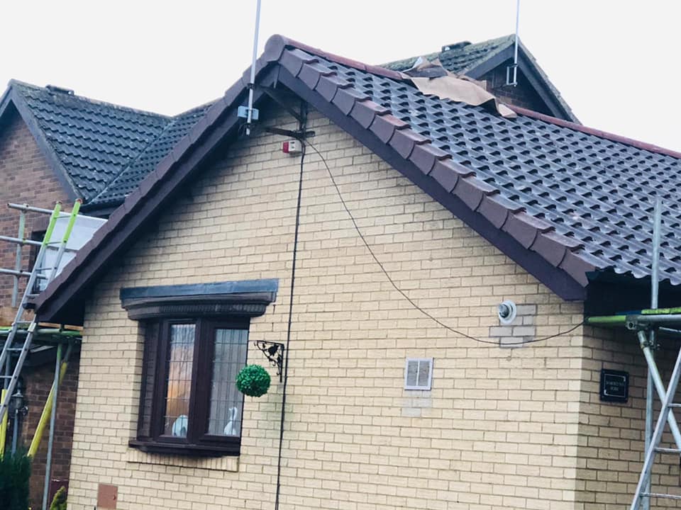 Professional roofers working on a property in London - KS Roof Master
