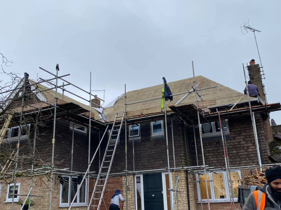 Professional roofers working on a property in London - KS Roof Master