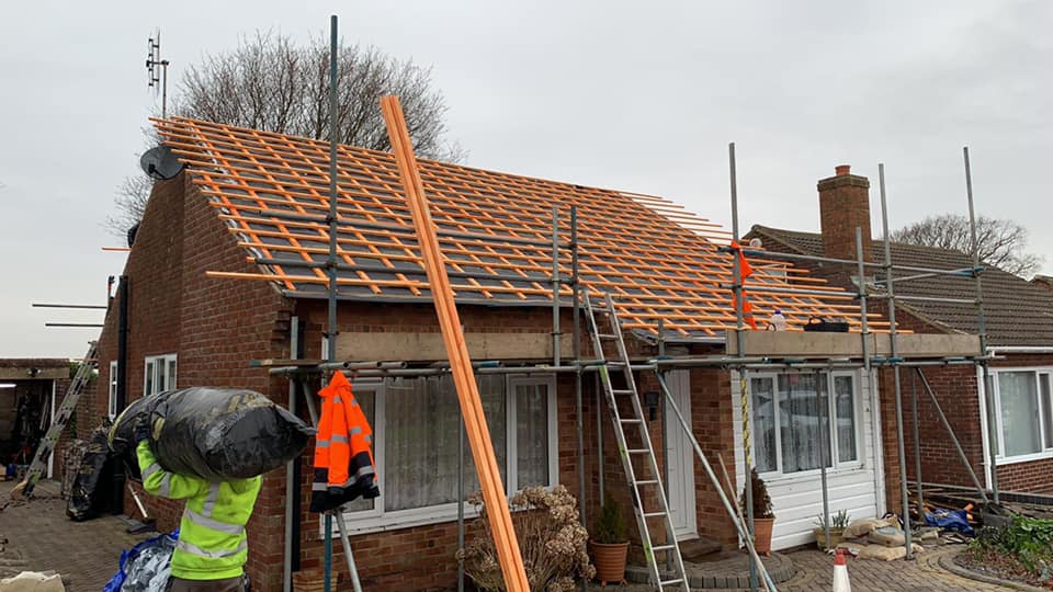 Professional roofers working on a property in London - KS Roof Master
